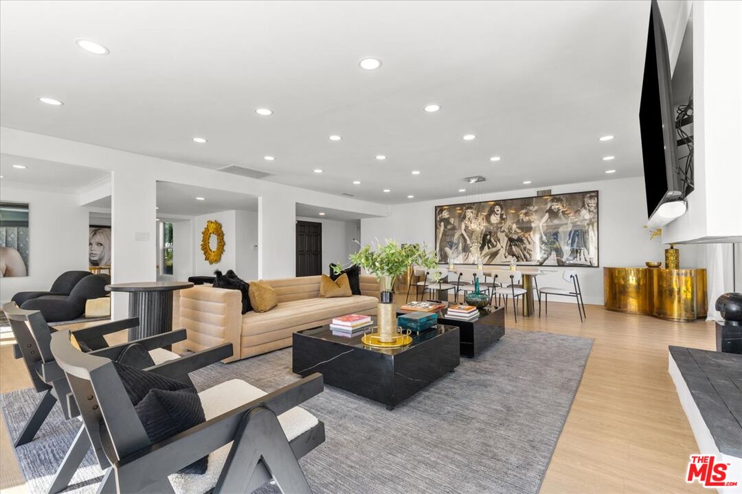 1650 Clear View Drive Beverly Hills, CA 90210 - Photo 4 of 31 a living room with furniture kitchen view and a large window