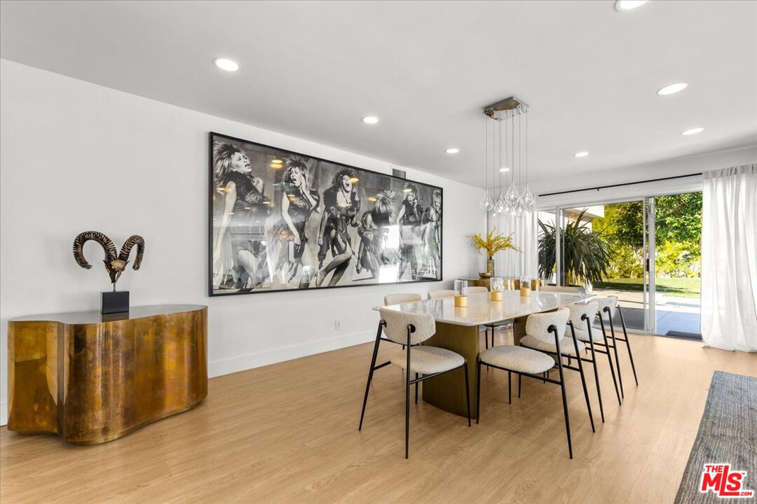 1650 Clear View Drive Beverly Hills, CA 90210 - Photo 8 of 31 a view of a dining room with furniture window and outside view