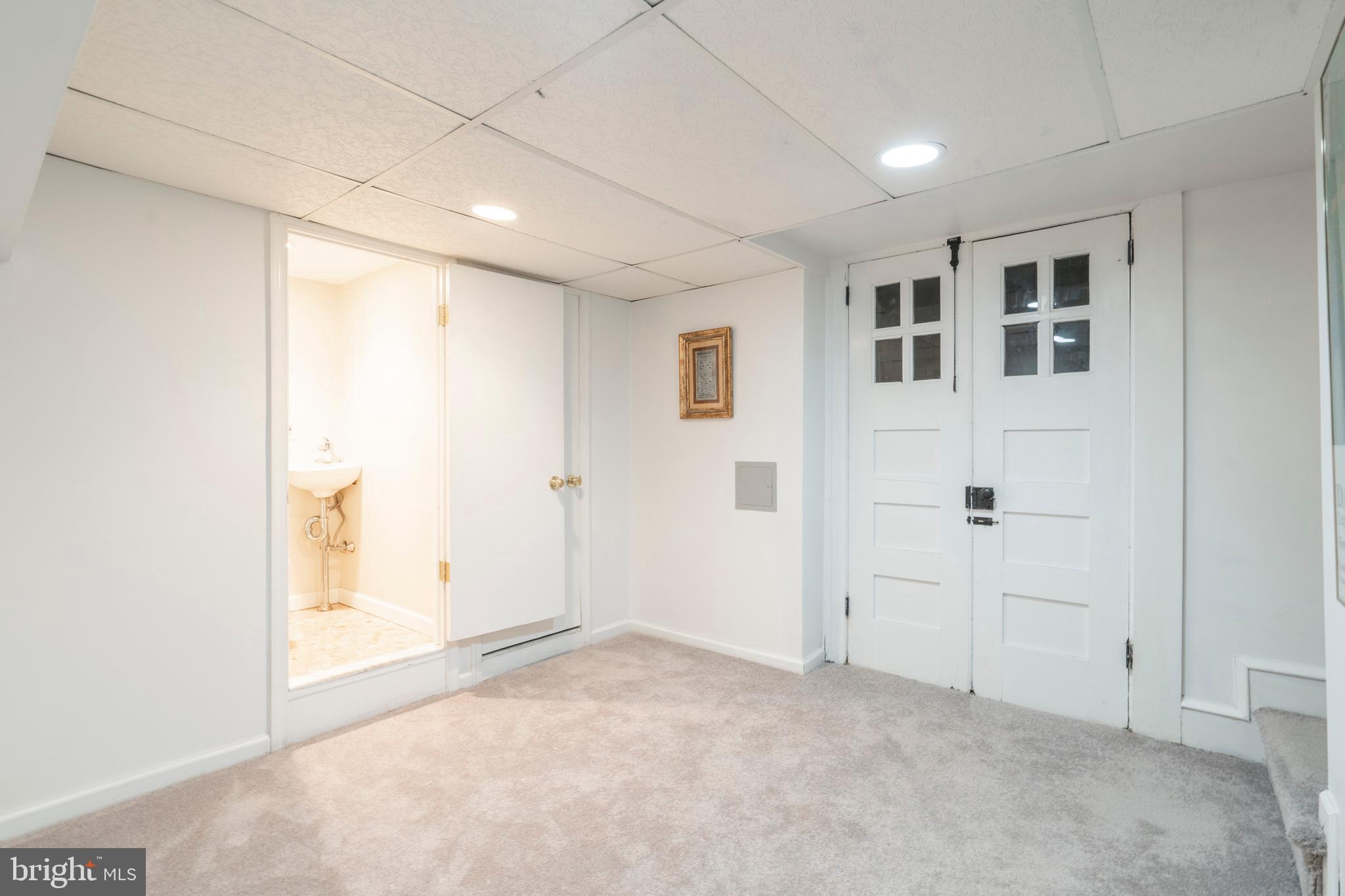 129 Valley Road Ardmore, PA 19003 - Photo 40 of 54 Partially Finished Basement with Half Bath
