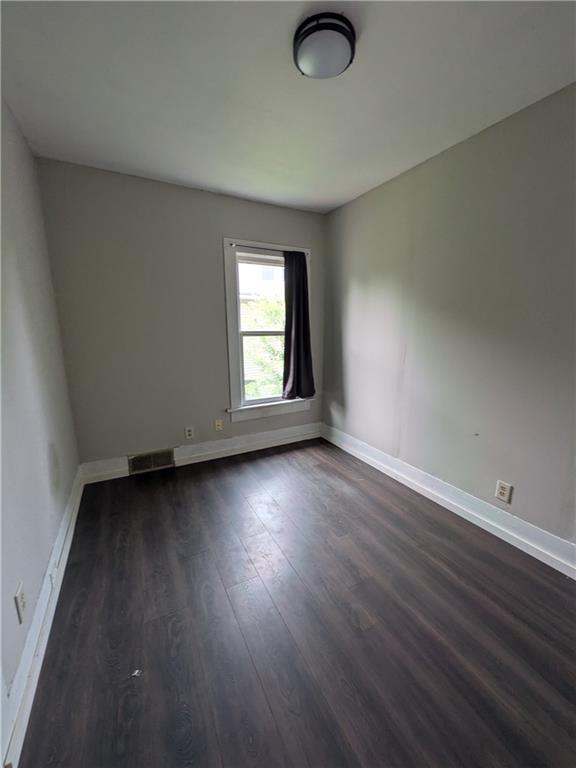 508 Electric Street New Castle, PA 16101 - Photo 12 of 14 an empty room with wooden floor and windows