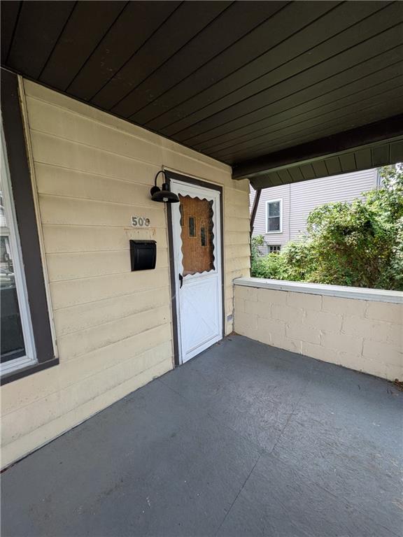 508 Electric Street New Castle, PA 16101 - Photo 2 of 14 a view of a big room with wooden floor and windows