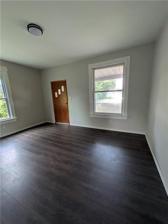 508 Electric Street New Castle, PA 16101 - Photo 3 of 14 an empty room with wooden floor and windows