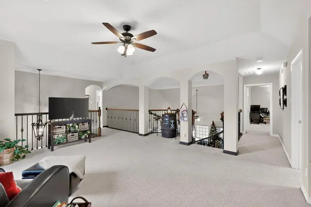 a view of a livingroom with furniture and a flat screen tv