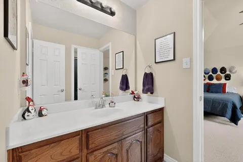 a bathroom with a sink double vanity and a mirror