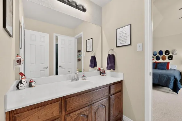 a bathroom with a sink double vanity and a mirror