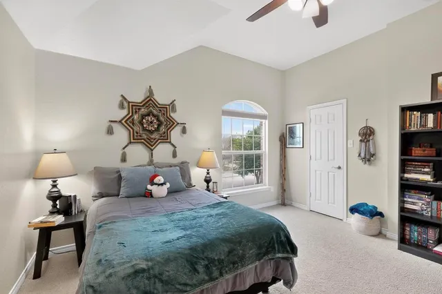 a bedroom with bed and a window