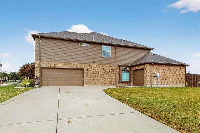 a front view of a house with yard
