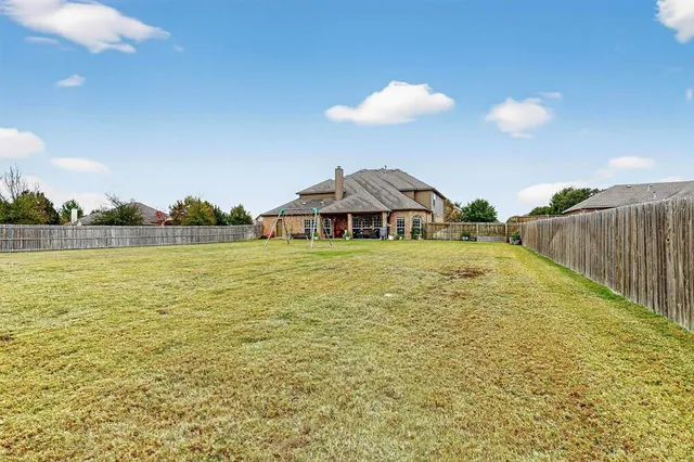 a view of a swimming pool with a table and chairs