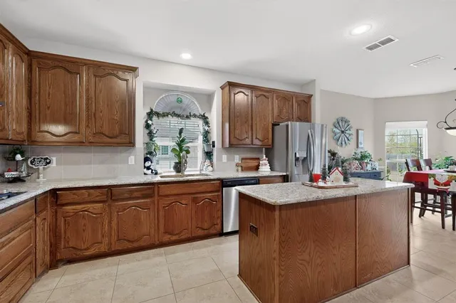 a kitchen with sink cabinets and window
