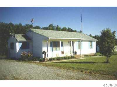 8403 Golansville Road Ruther Glen, VA 22546 - Photo 1 of 1 a front view of a house with a yard
