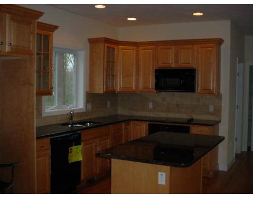 3 Devonshire Road Amesbury, MA 01913 - Photo 3 of 8 a kitchen with a sink stove and microwave