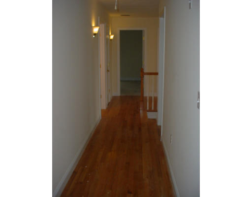 3 Devonshire Road Amesbury, MA 01913 - Photo 7 of 8 a view of a hallway with wooden floor