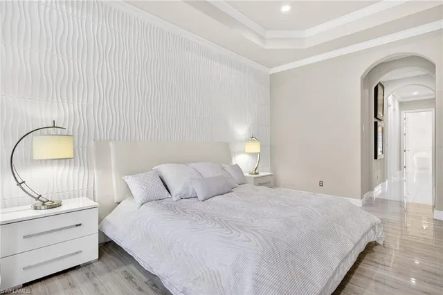 a bedroom with bed and a sink