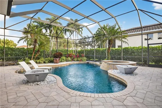 a view of a swimming pool with a patio
