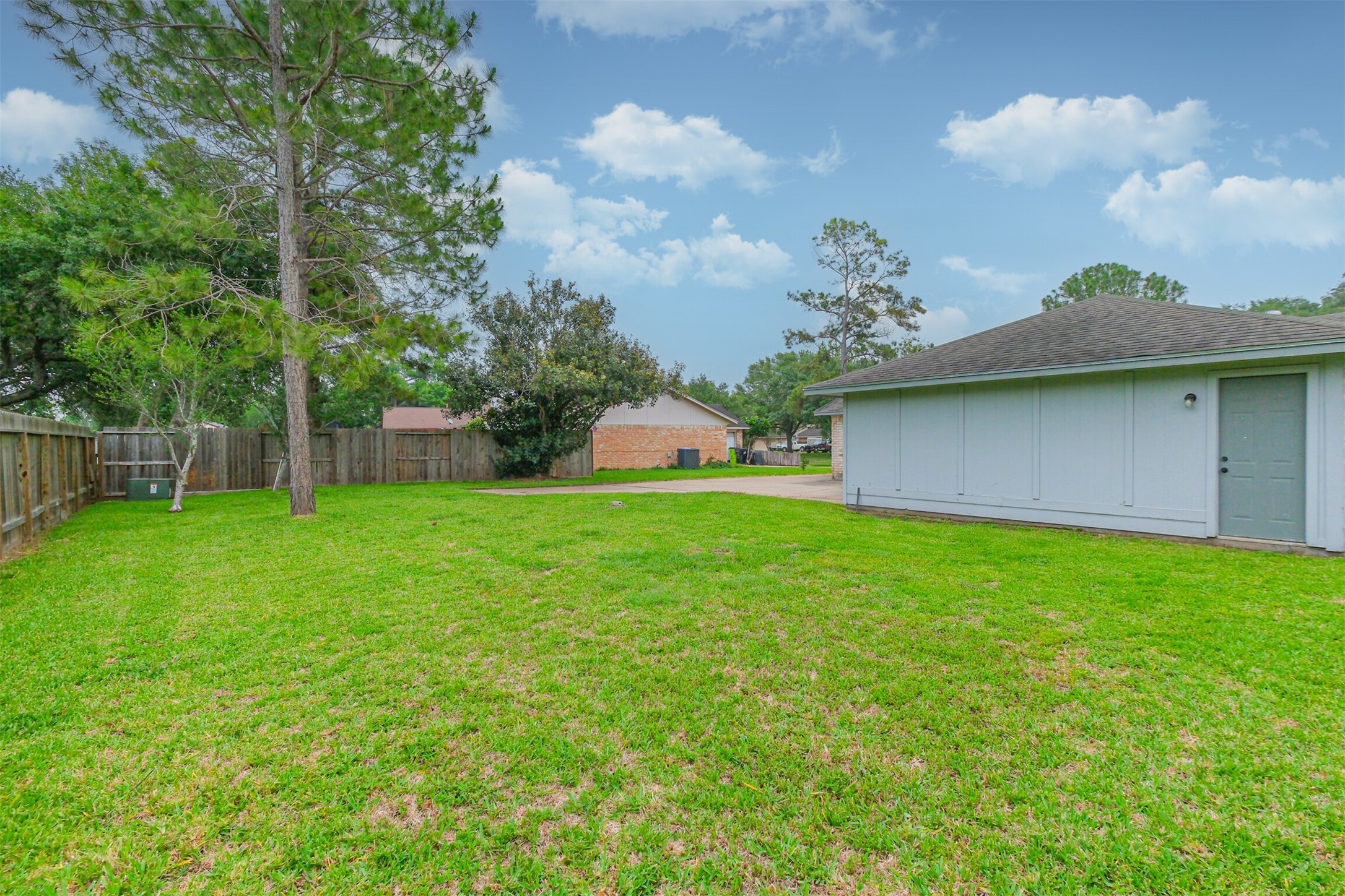 2705 Parrott Avenue Rosenberg, TX 77471 - Photo 30 of 37 a view of a house with a backyard