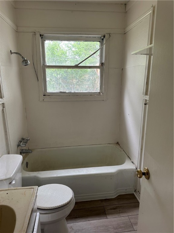 1912 Mabry Street Waco, TX 76711 - Photo 3 of 7 a bathroom with a toilet and a bathtub
