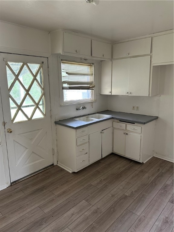 1912 Mabry Street Waco, TX 76711 - Photo 5 of 7 a kitchen with wooden floors and sink