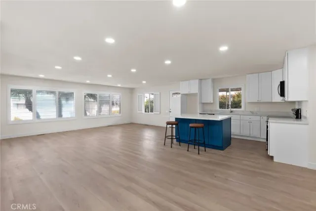 a view of kitchen with window and wooden floor