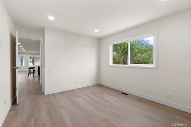 a view of an entryway with wooden floor