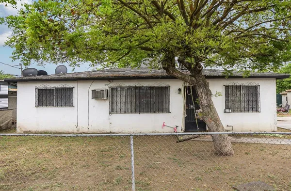 a house with trees in front of it