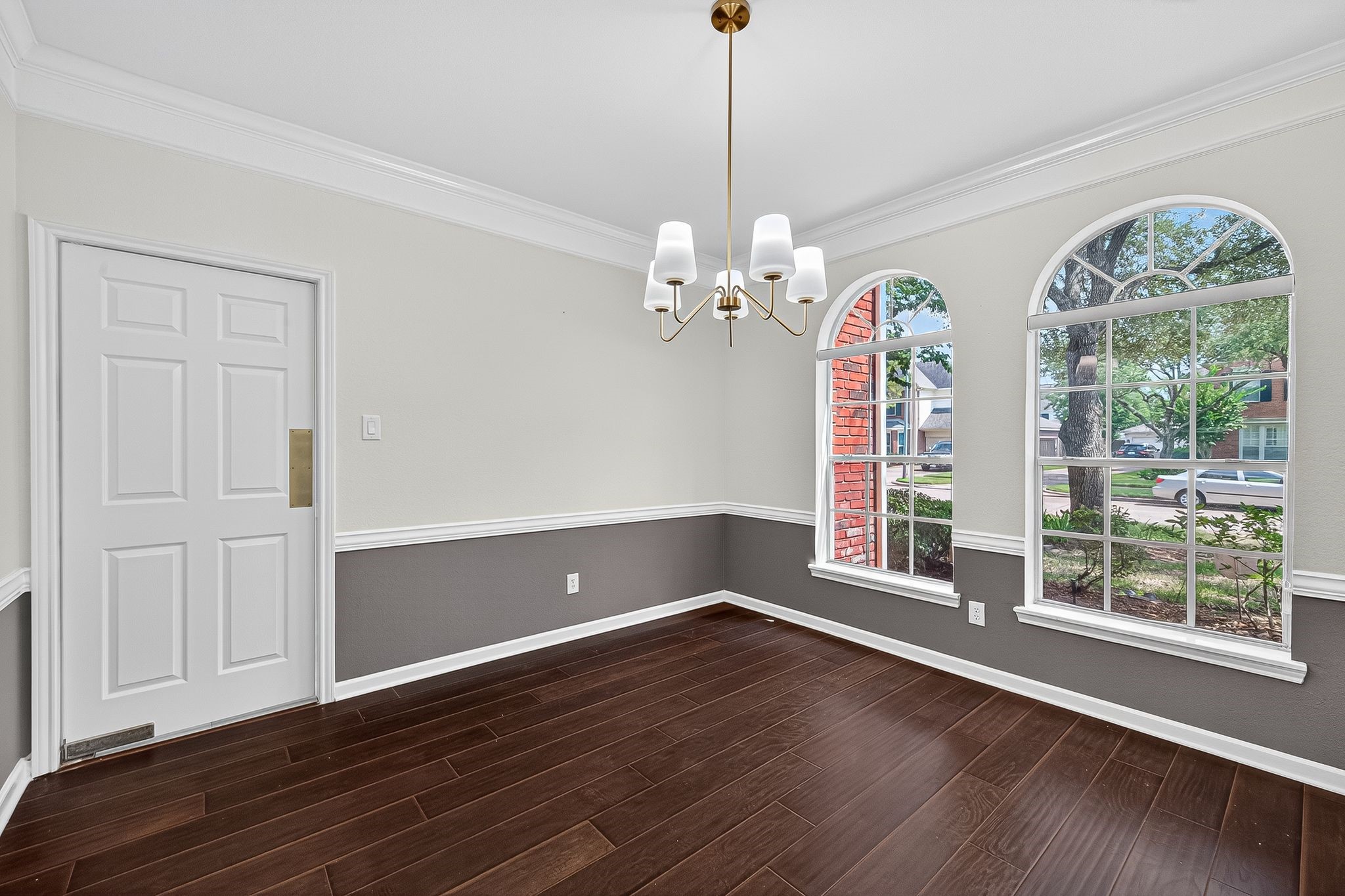 22406 Piper Terrace Lane Katy, TX 77450 - Photo 8 of 44 a view of an empty room with wooden floor and a window