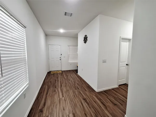 a view of a livingroom with wooden floor