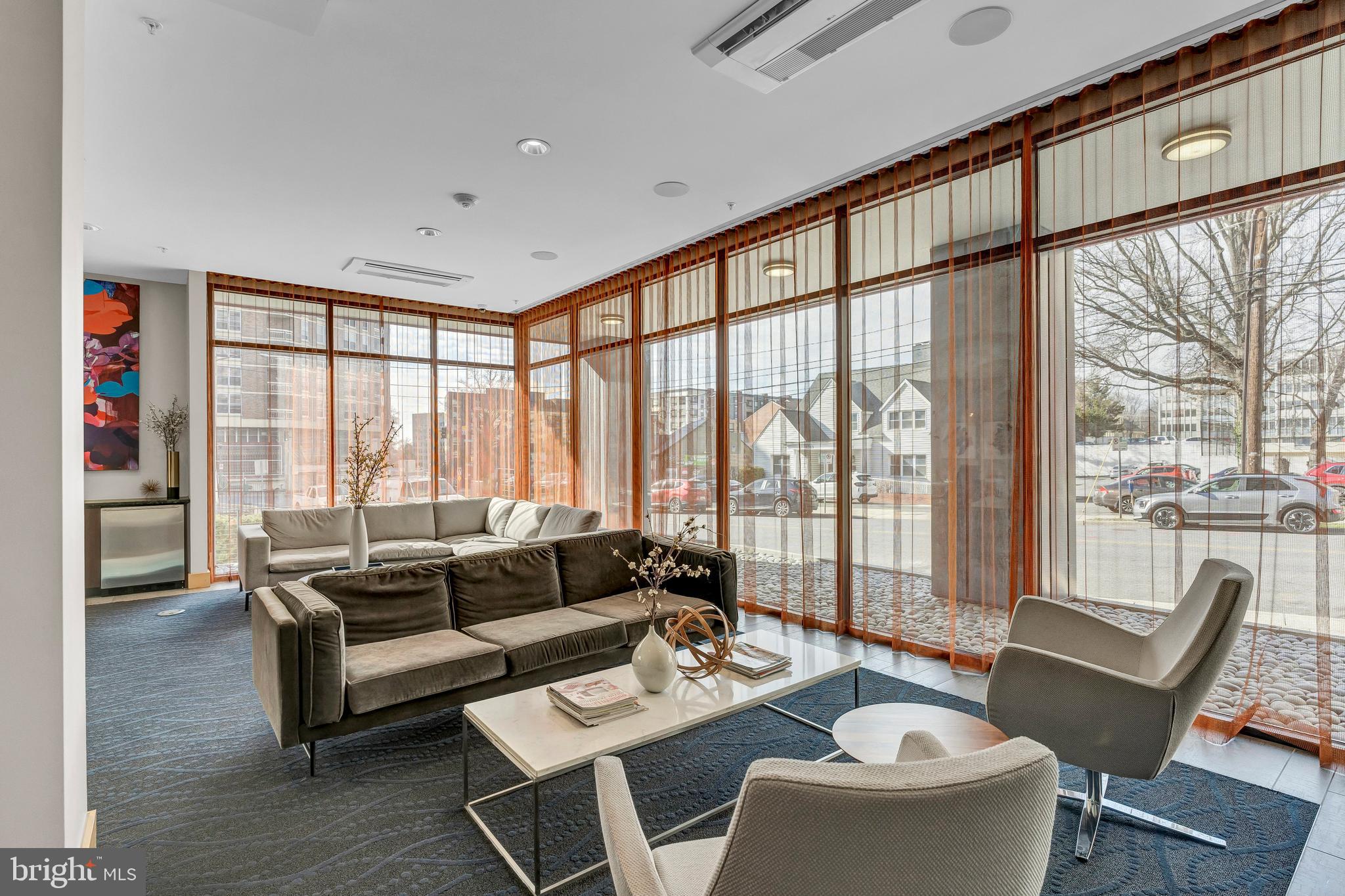 1320 Fenwick Lane, Unit 304 Silver Spring, MD 20910 - Photo 59 of 64 a living room with furniture and a large window