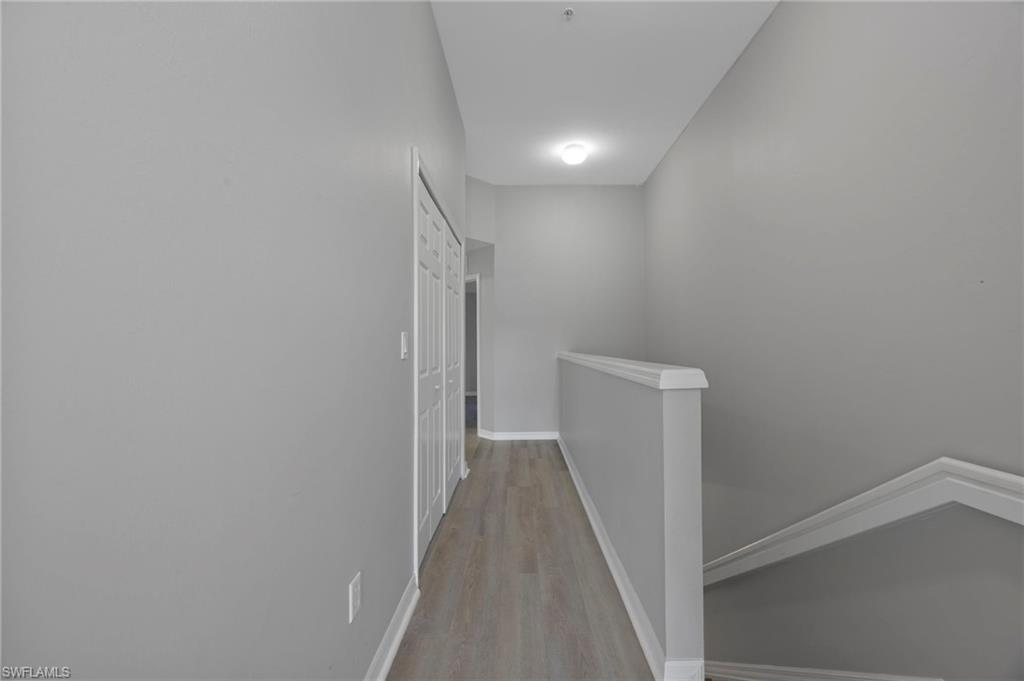 15930 Marcello Circle, Unit 242 Naples, FL 34110 - Photo 12 of 32 a view of hallway with closet