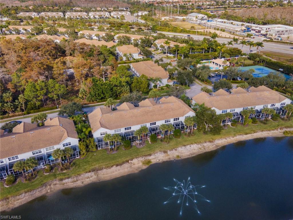 15930 Marcello Circle, Unit 242 Naples, FL 34110 - Photo 28 of 32 an aerial view of residential houses with outdoor space and river