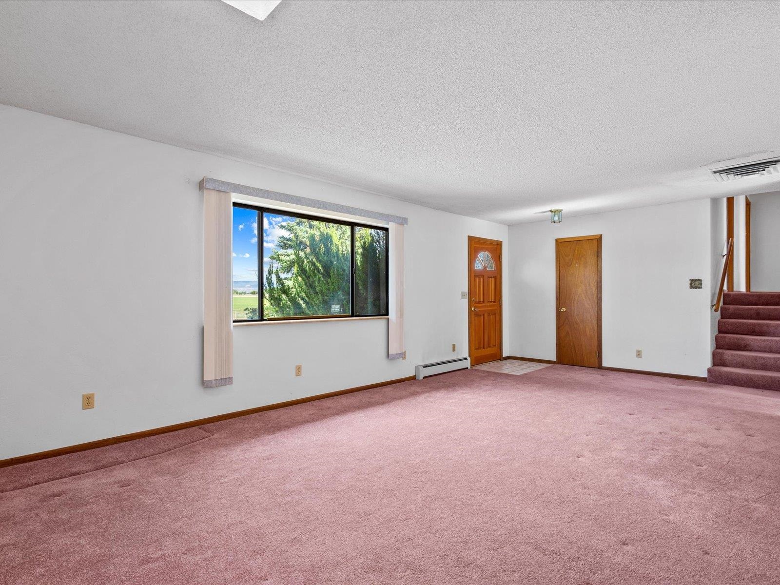 1425 19 Road Fruita, CO 81521 - Photo 12 of 42 an empty room with windows
