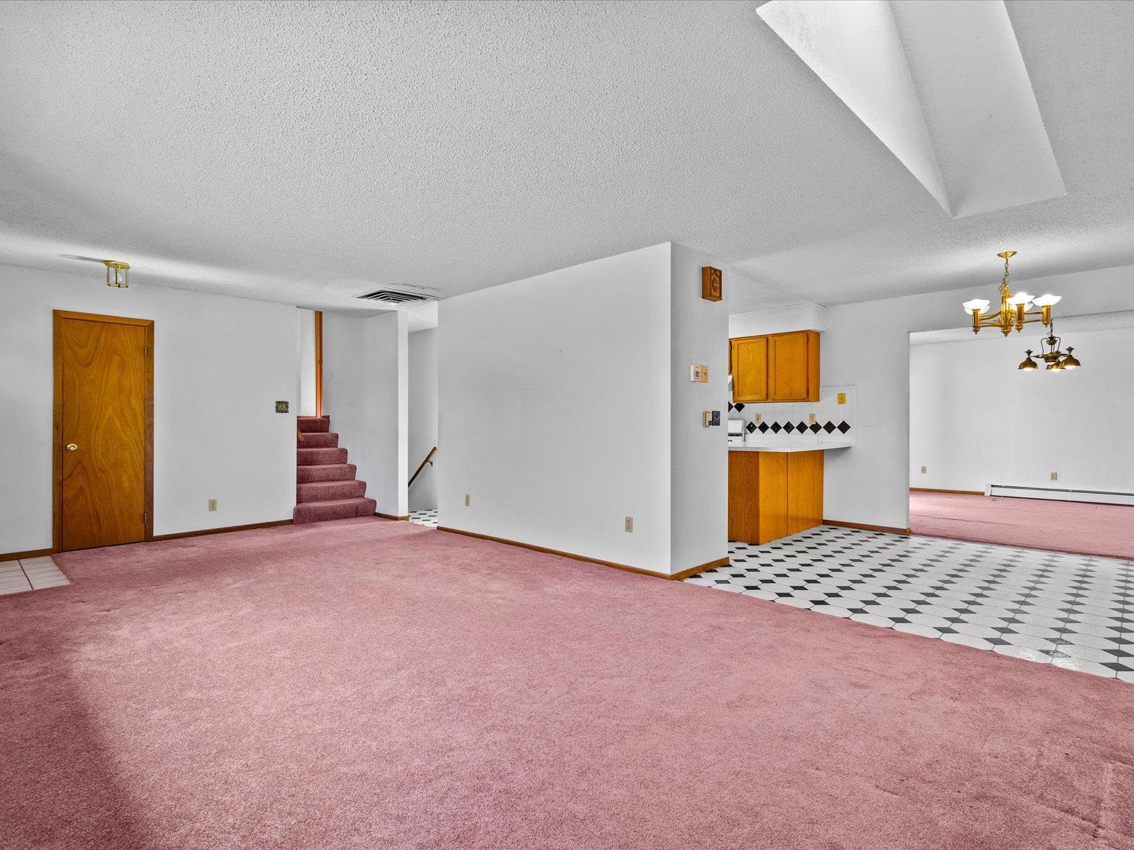 1425 19 Road Fruita, CO 81521 - Photo 13 of 42 a view of an empty room with a fireplace and a window