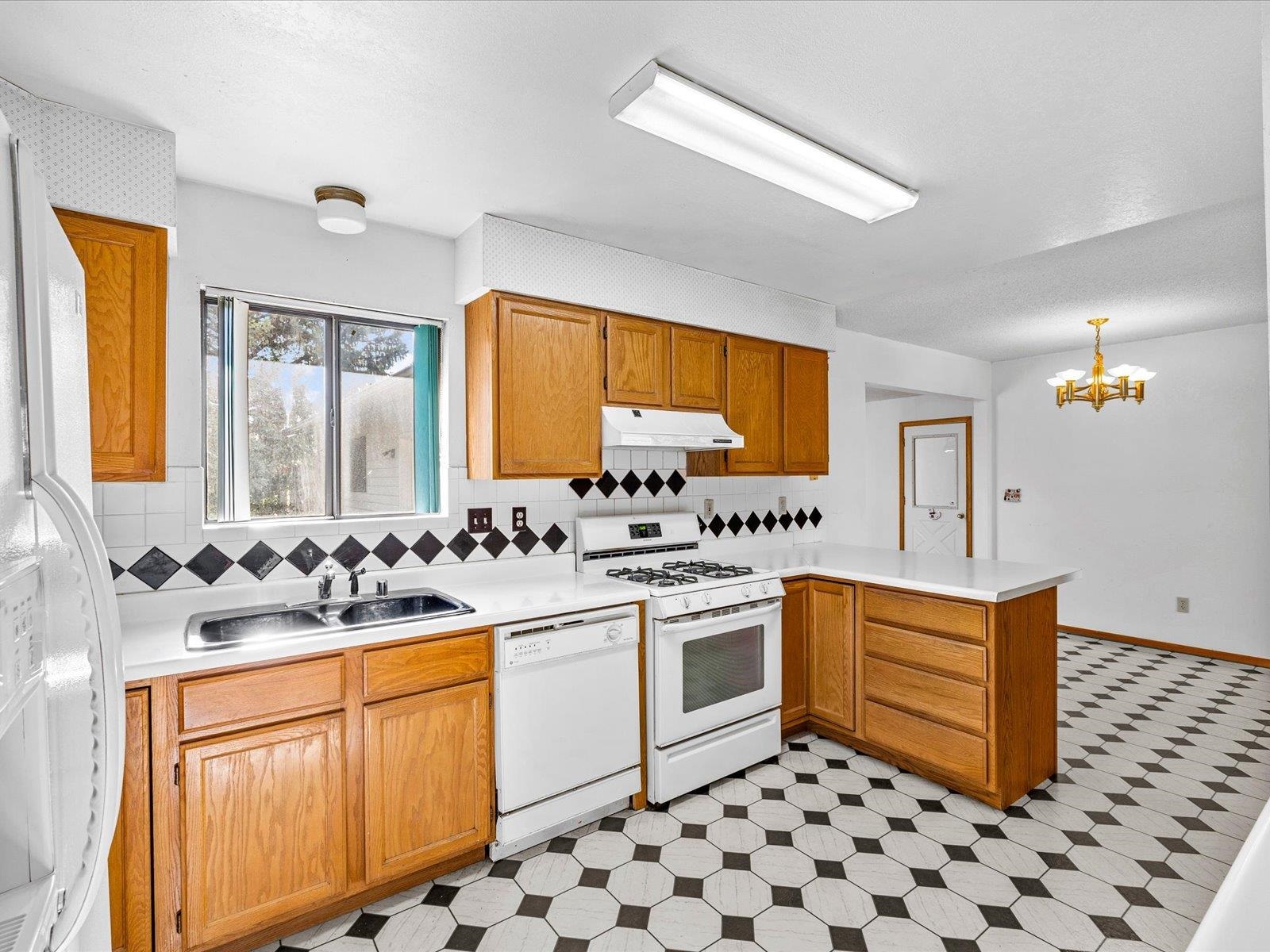 1425 19 Road Fruita, CO 81521 - Photo 17 of 42 a kitchen with a sink stove and cabinets