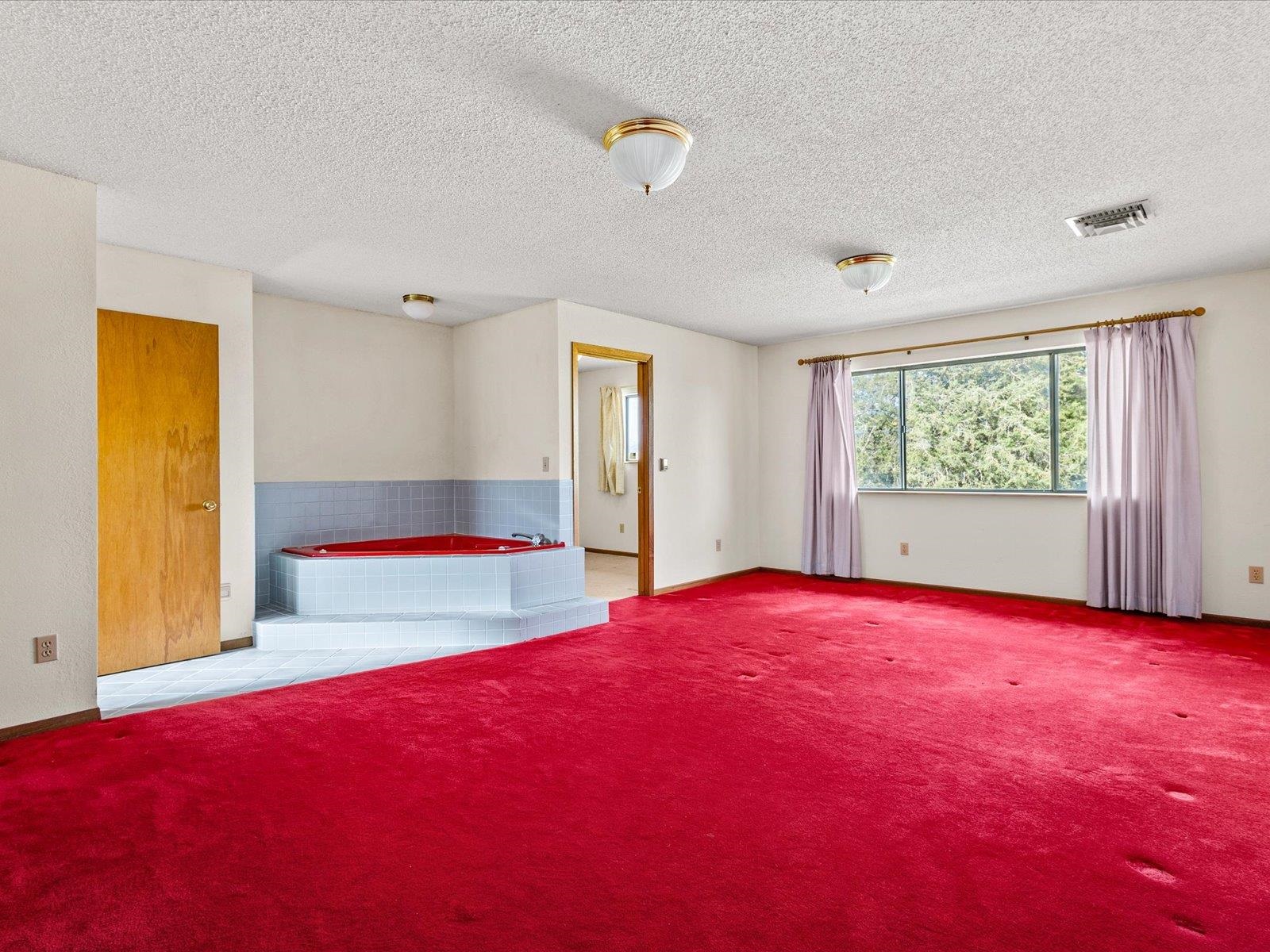 1425 19 Road Fruita, CO 81521 - Photo 21 of 42 a view of empty room with wooden floor and fan