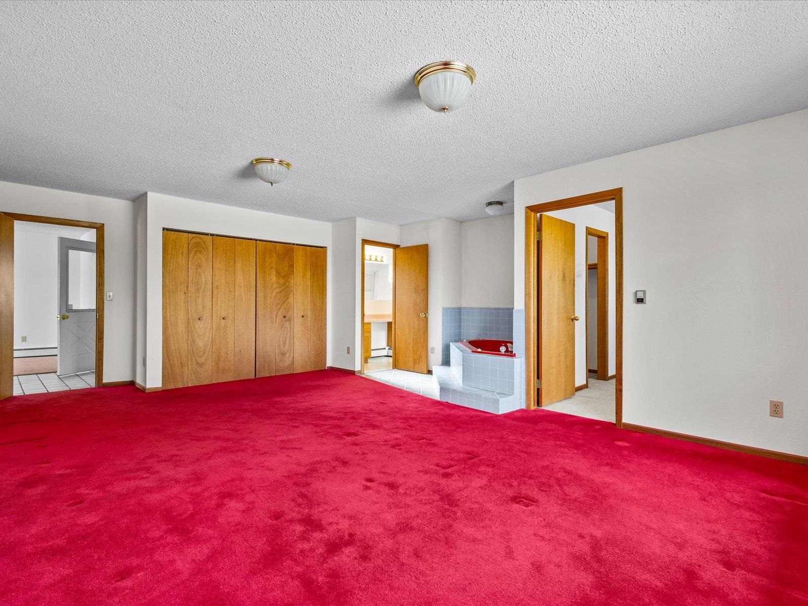 1425 19 Road Fruita, CO 81521 - Photo 22 of 42 a bed room with a bed and a large window