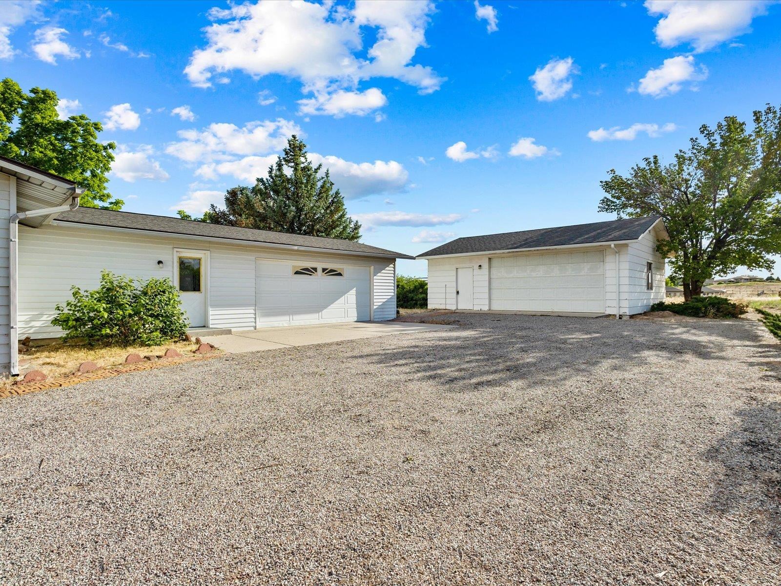 1425 19 Road Fruita, CO 81521 - Photo 41 of 42 a front view of house with garage and yard