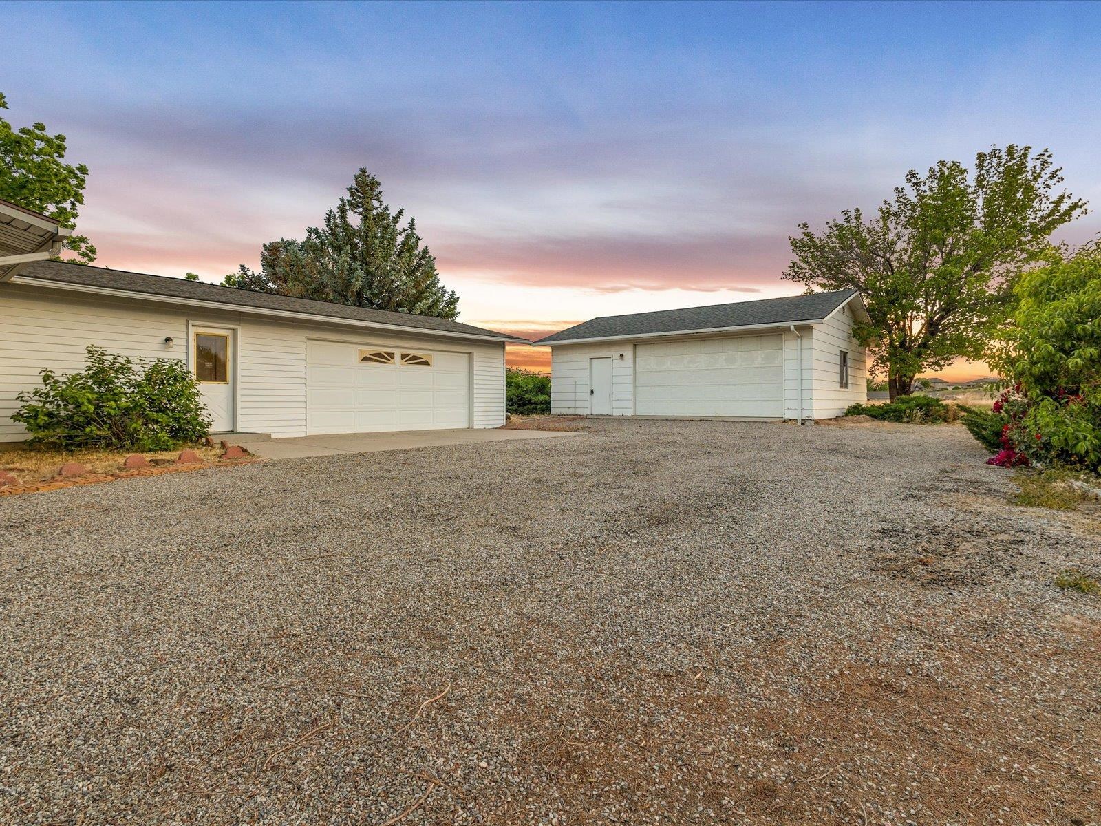1425 19 Road Fruita, CO 81521 - Photo 9 of 42 a front view of house with yard and trees