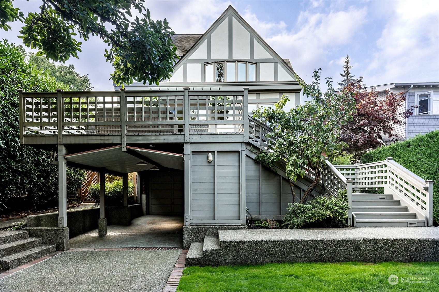 1206 37th Avenue East Seattle, WA 98112 - Photo 16 of 34 a view of house with garden and trees