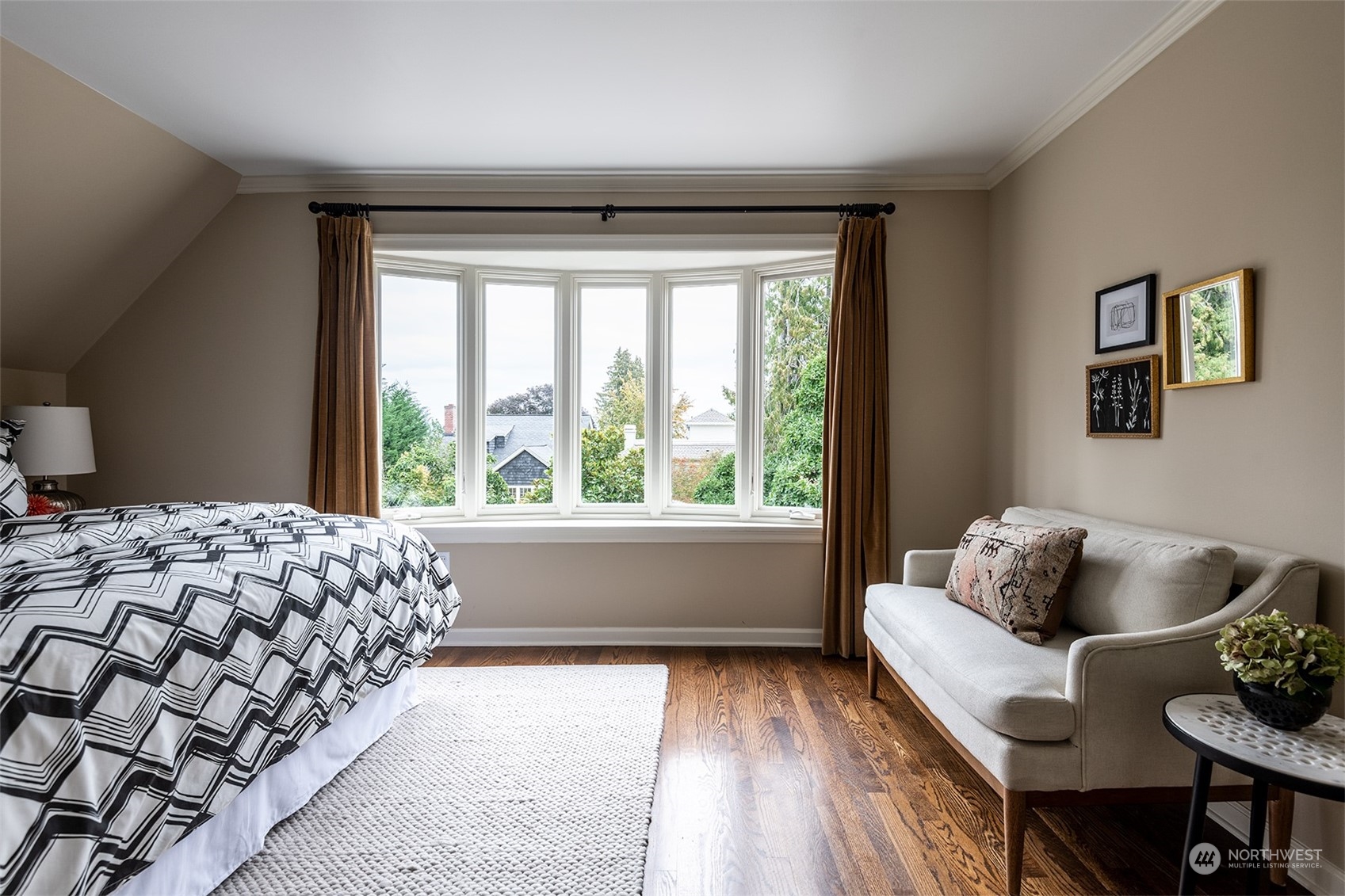 1206 37th Avenue East Seattle, WA 98112 - Photo 23 of 34 a bedroom with a bed and a window