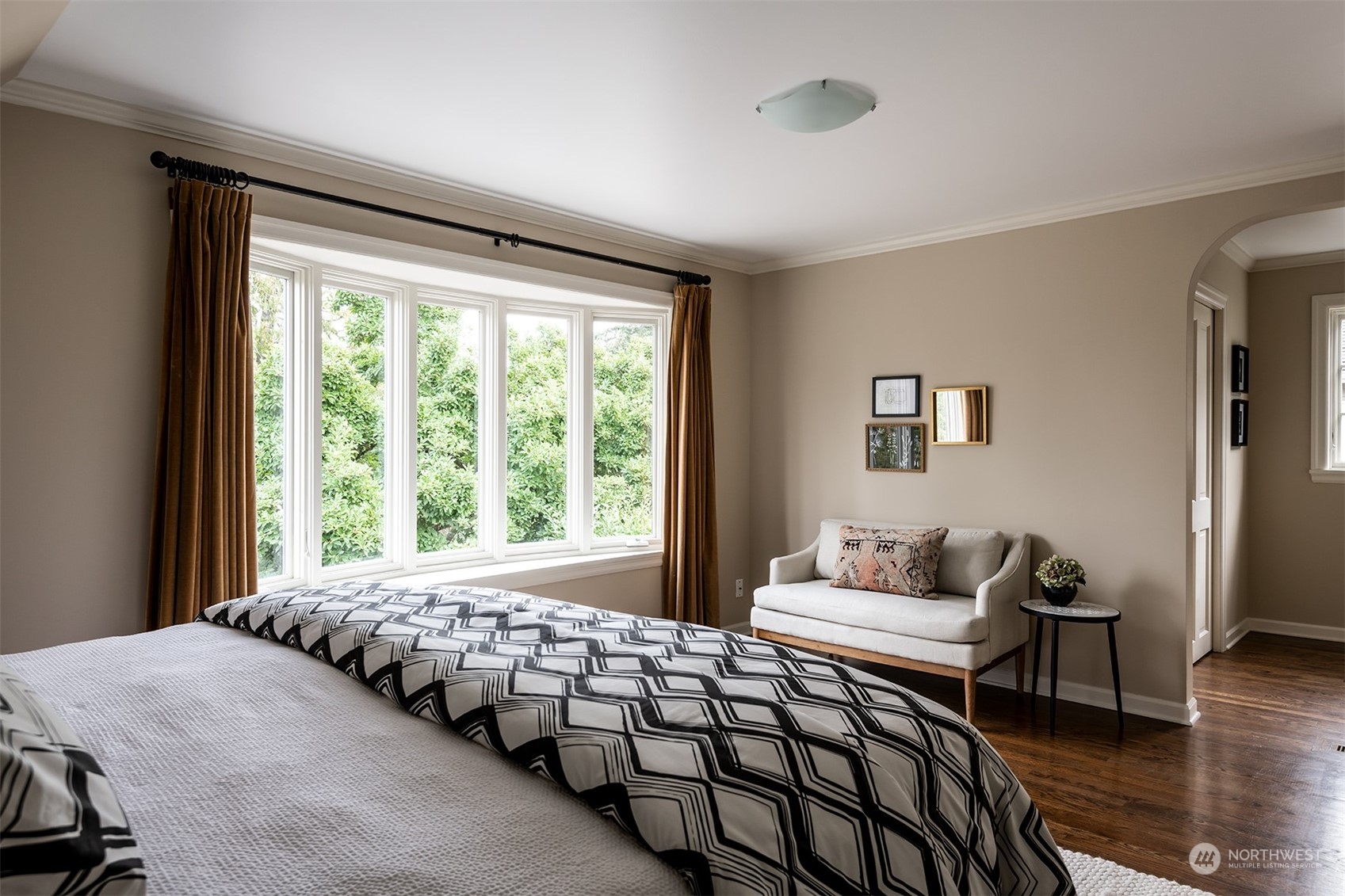 1206 37th Avenue East Seattle, WA 98112 - Photo 24 of 34 a bedroom with double bed and a window