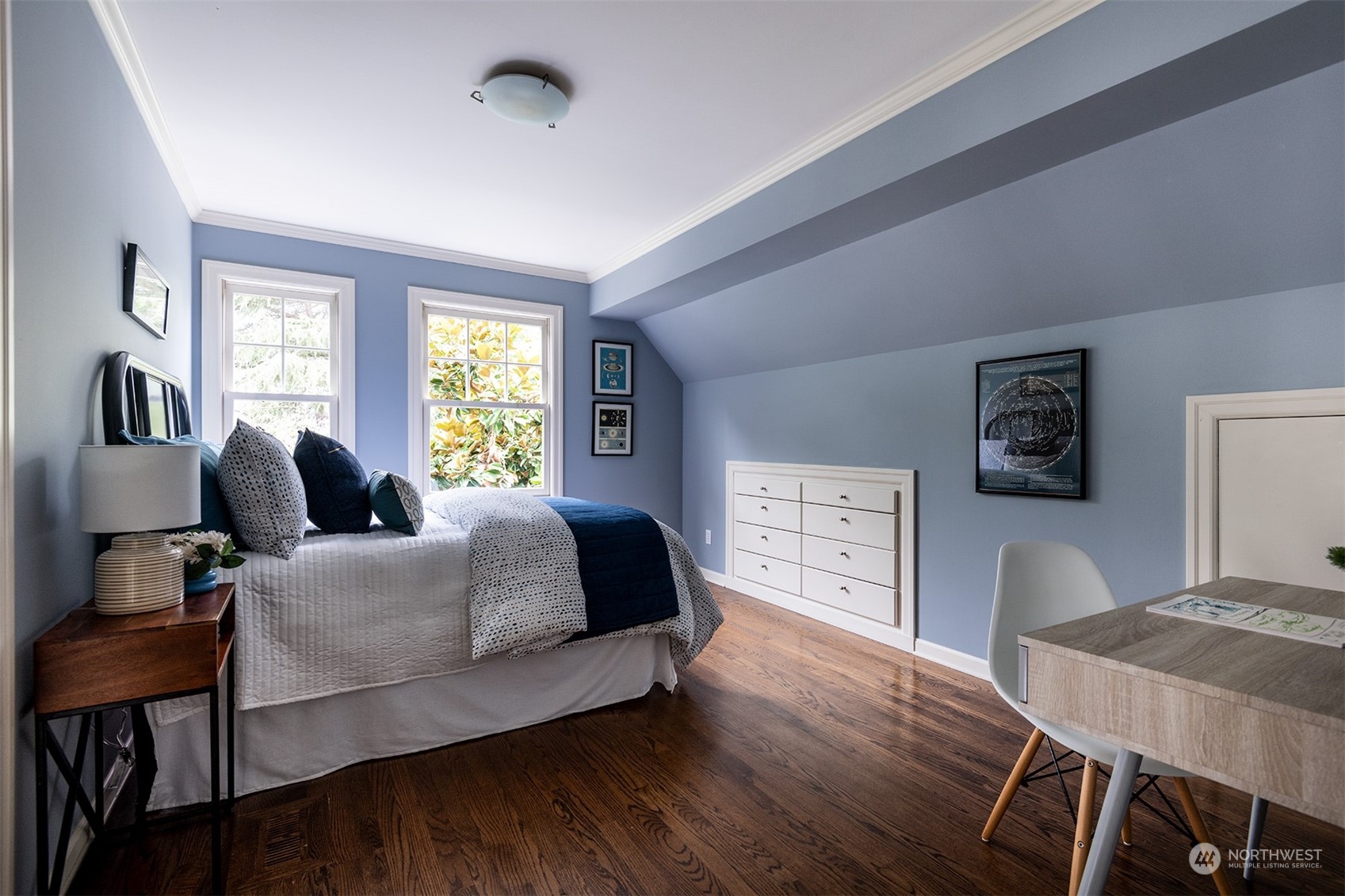 1206 37th Avenue East Seattle, WA 98112 - Photo 26 of 34 a bedroom with a bed and wooden floor
