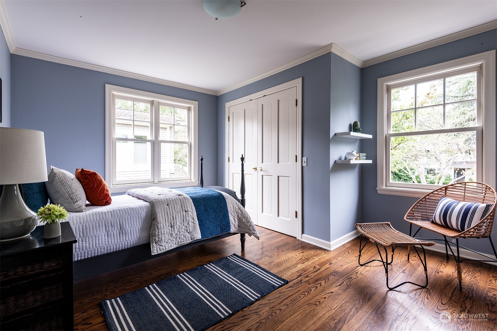 1206 37th Avenue East Seattle, WA 98112 - Photo 28 of 34 a bedroom with a bed and wooden floor