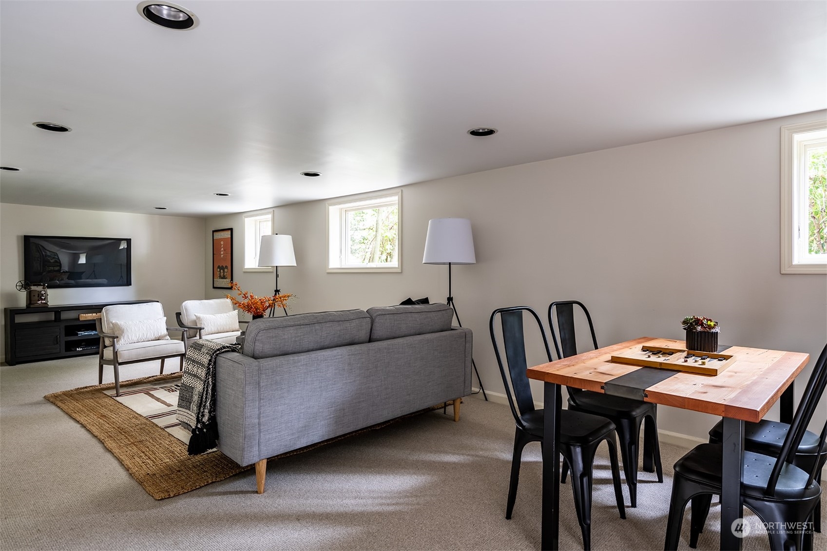 1206 37th Avenue East Seattle, WA 98112 - Photo 31 of 34 a living room with furniture and a flat screen tv