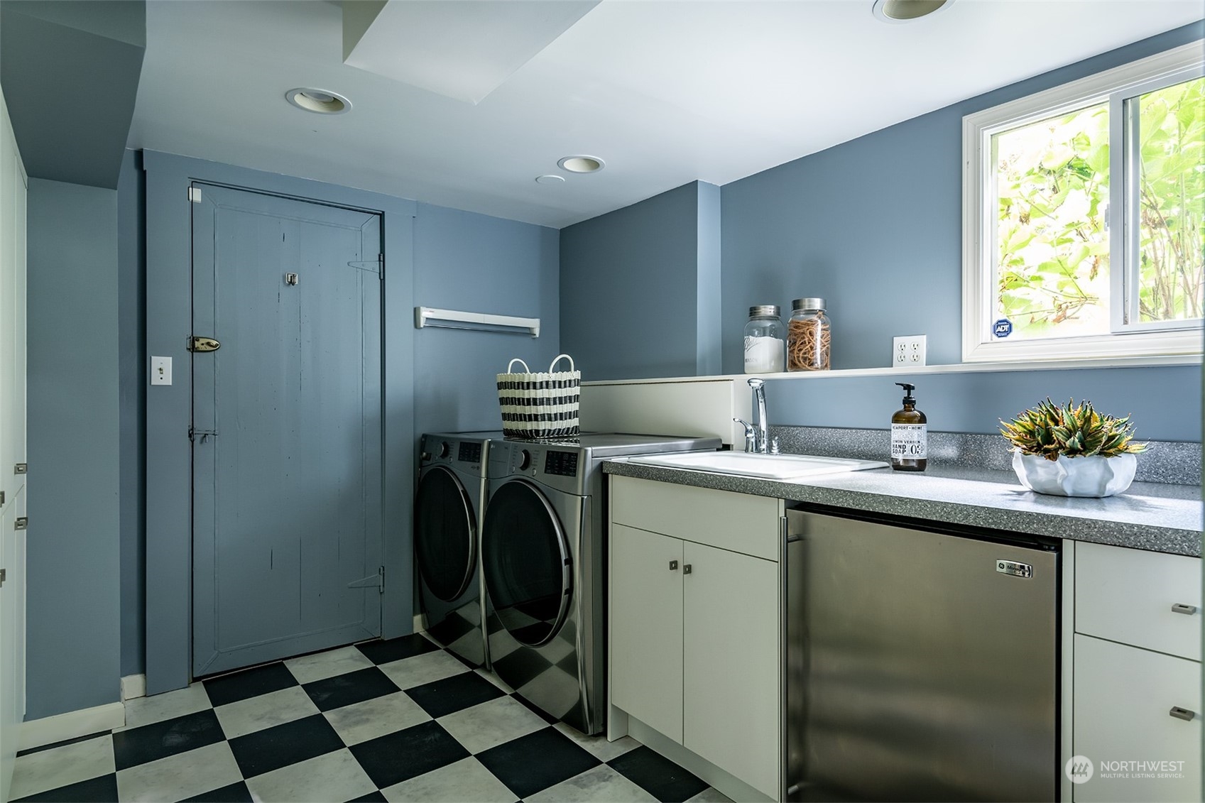 1206 37th Avenue East Seattle, WA 98112 - Photo 33 of 34 a kitchen with a sink a refrigerator and a window