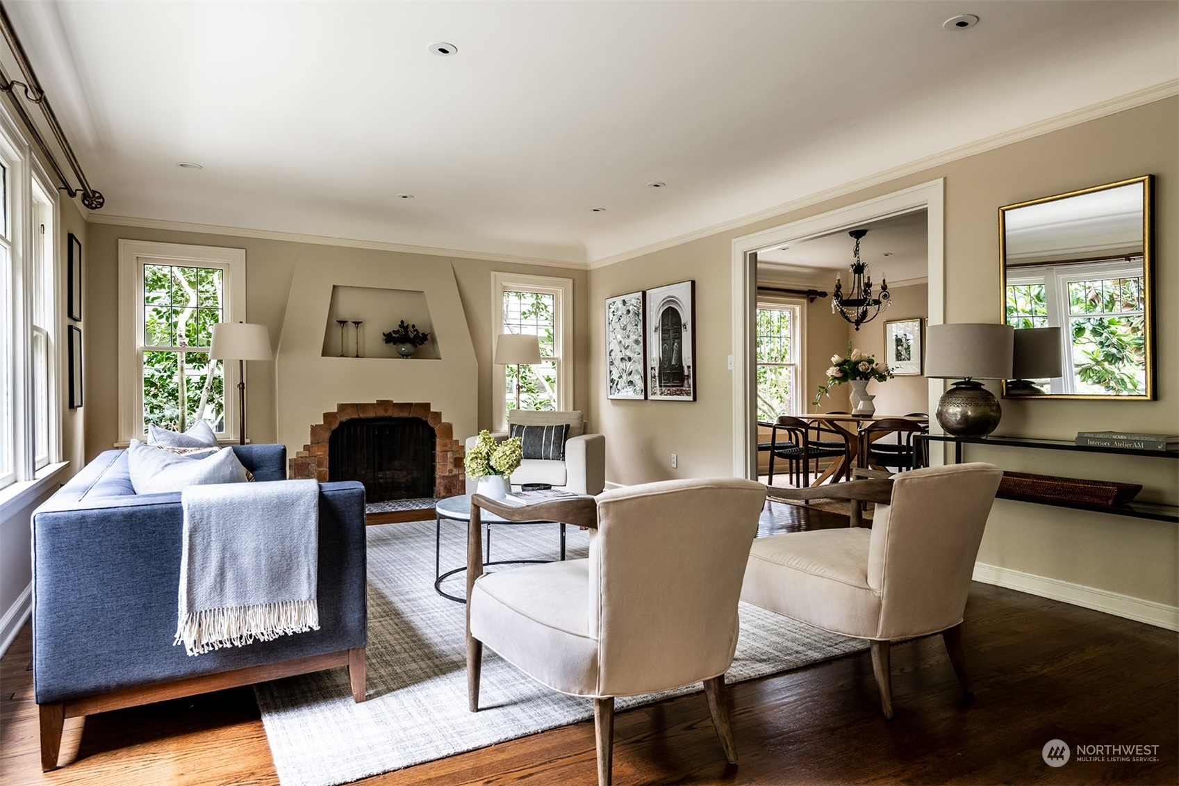 1206 37th Avenue East Seattle, WA 98112 - Photo 6 of 34 a living room with furniture a fireplace and a table