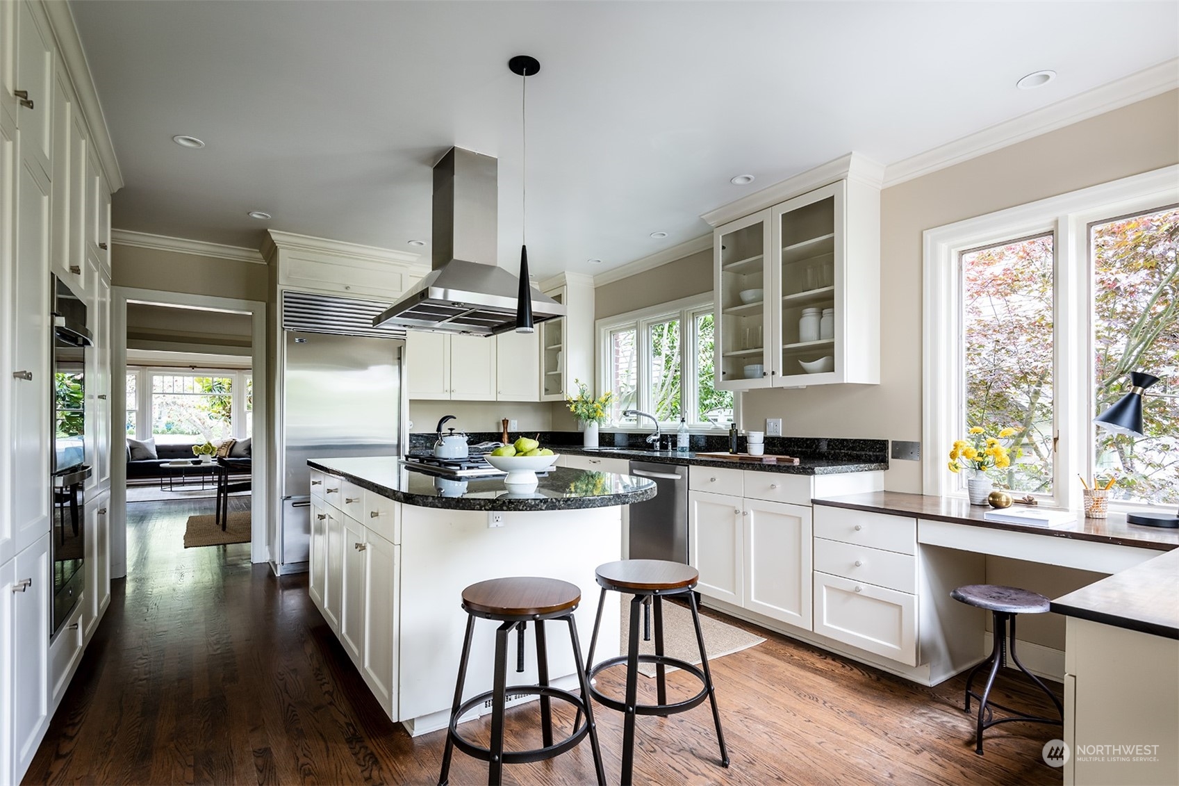 1206 37th Avenue East Seattle, WA 98112 - Photo 9 of 34 a kitchen with stainless steel appliances a stove a sink dishwasher and a refrigerator with wooden floor