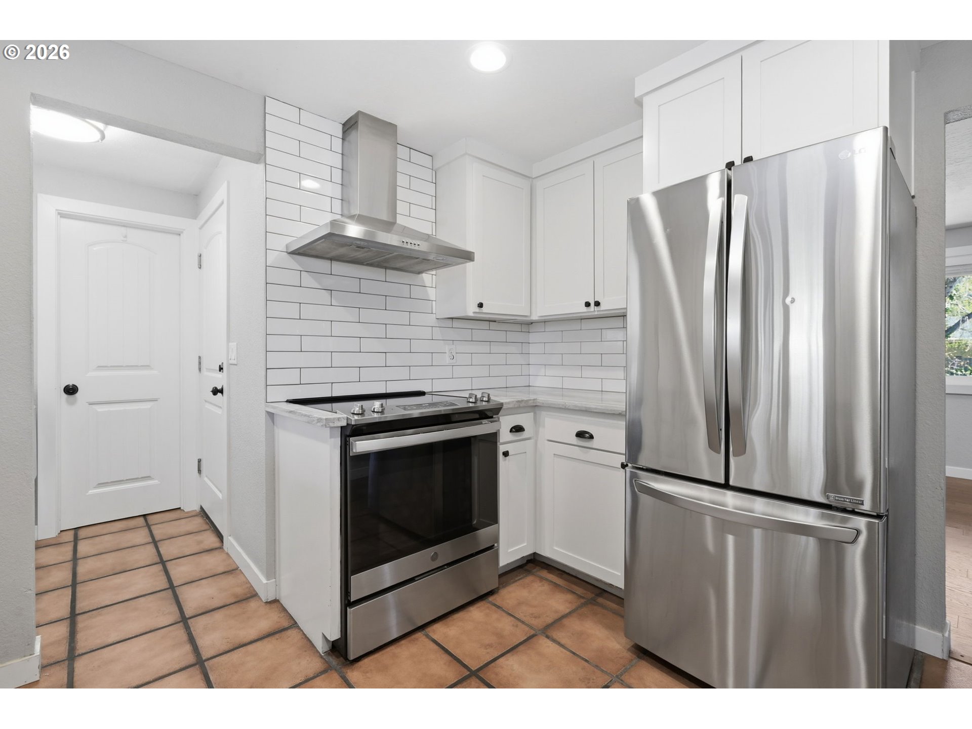 2612 Sage Street Eugene, OR 97404 - Photo 13 of 45 a kitchen with stainless steel appliances a refrigerator and a stove