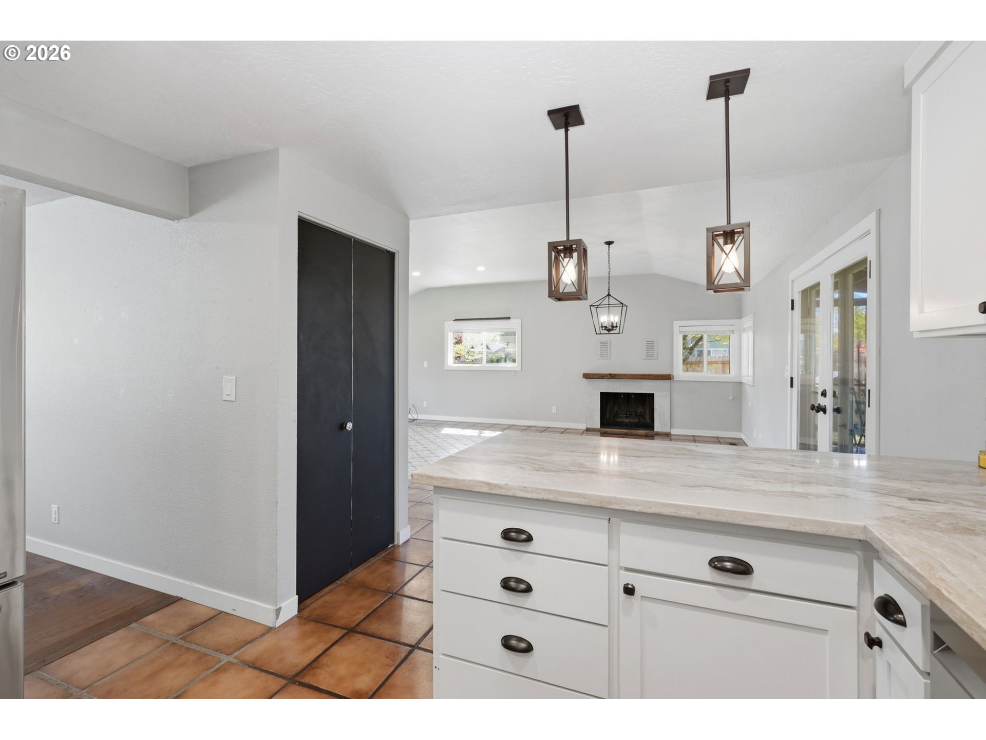2612 Sage Street Eugene, OR 97404 - Photo 15 of 45 a kitchen with a refrigerator a sink and a wooden floor