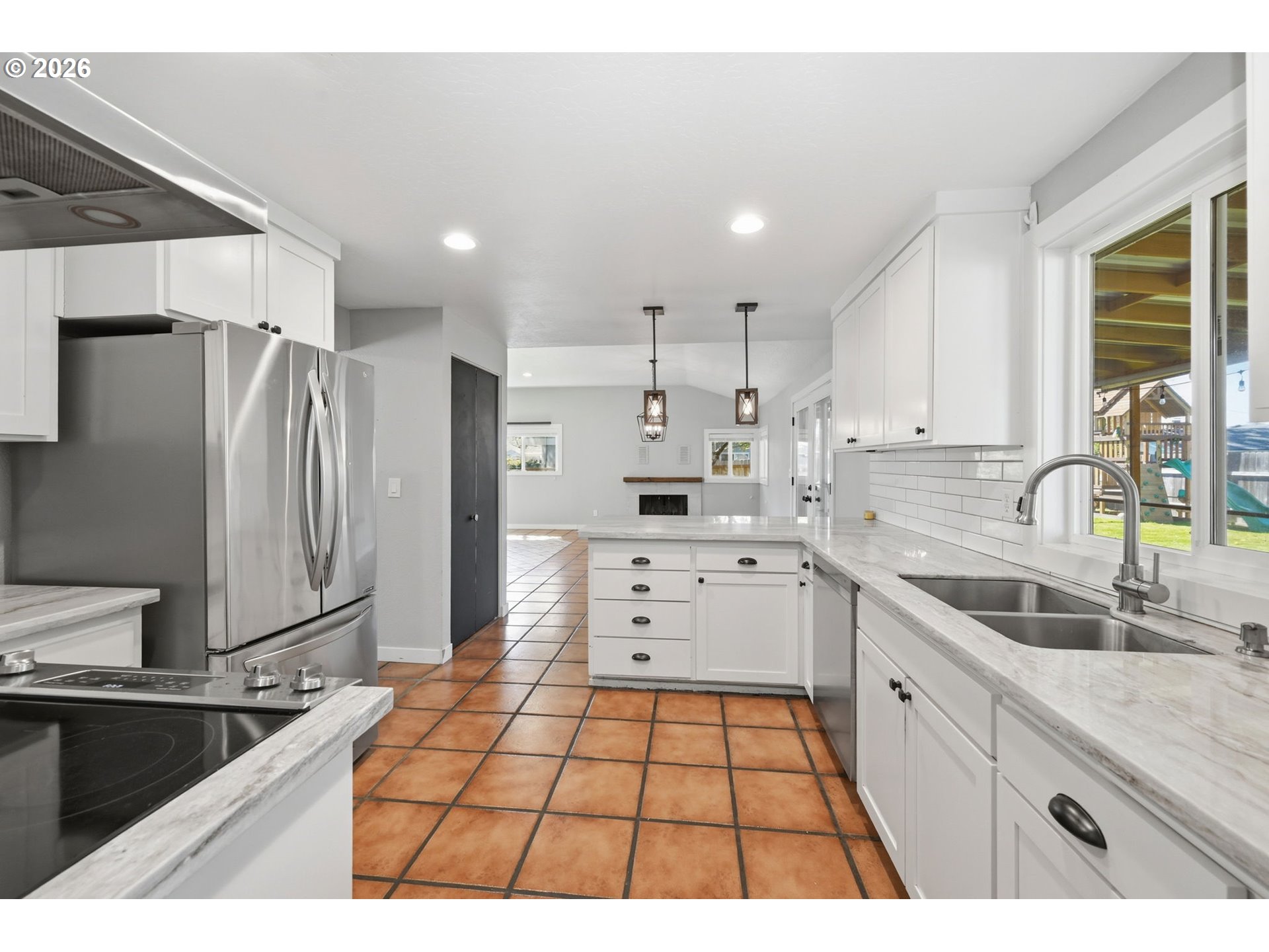 2612 Sage Street Eugene, OR 97404 - Photo 16 of 45 a kitchen with a sink stove and refrigerator