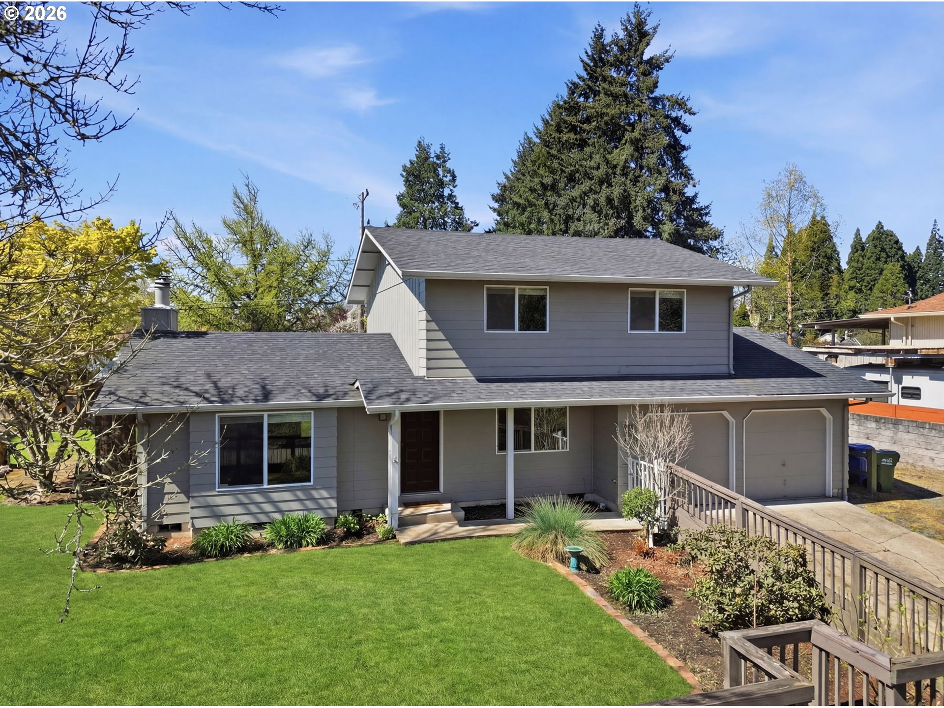 2612 Sage Street Eugene, OR 97404 - Photo 2 of 45 a front view of a house with a yard and porch