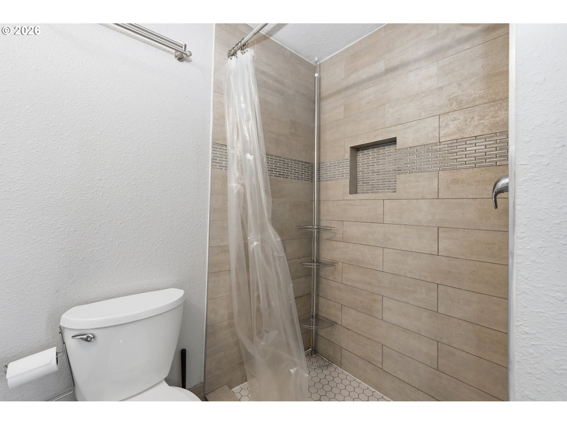 2612 Sage Street Eugene, OR 97404 - Photo 24 of 45 a bathroom with a toilet and a shower
